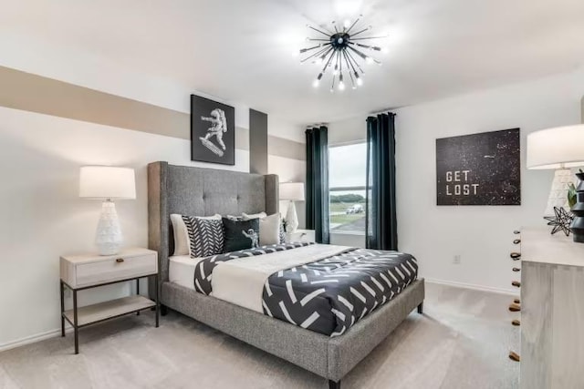 carpeted bedroom featuring a chandelier and baseboards