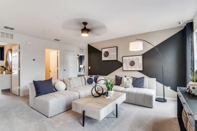 living room with light colored carpet and a ceiling fan