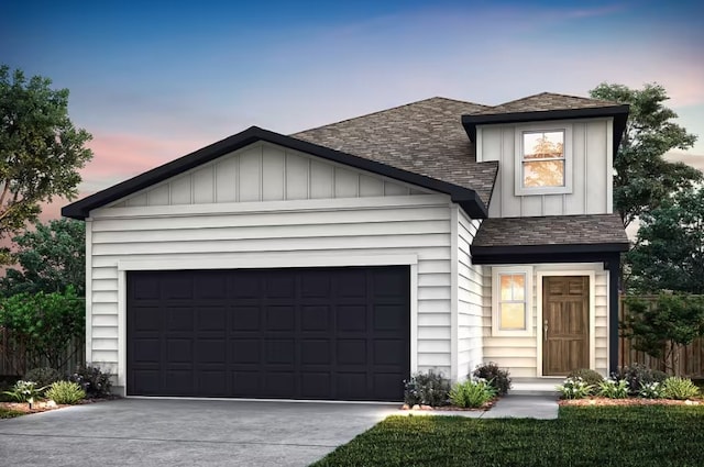 view of front facade with concrete driveway, an attached garage, board and batten siding, and a shingled roof
