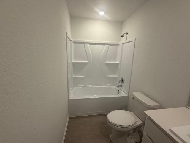 1117 Soapstone Pass, Maxwell, TX 78666 - full bathroom featuring vanity, toilet,  shower combination, baseboards, and wood finished floors