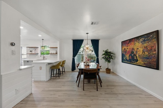 8805 Ravello Pass, Austin, TX 78749 - dining room with light wood-style floors, healthy amount of natural light, baseboards, and recessed lighting