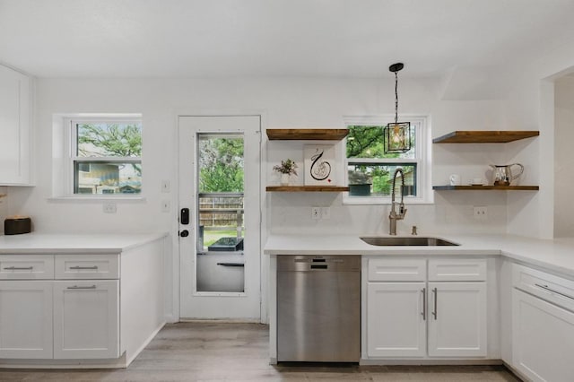 8805 Ravello Pass, Austin, TX 78749 - kitchen with dishwasher, a sink, open shelves, and light wood-style floors