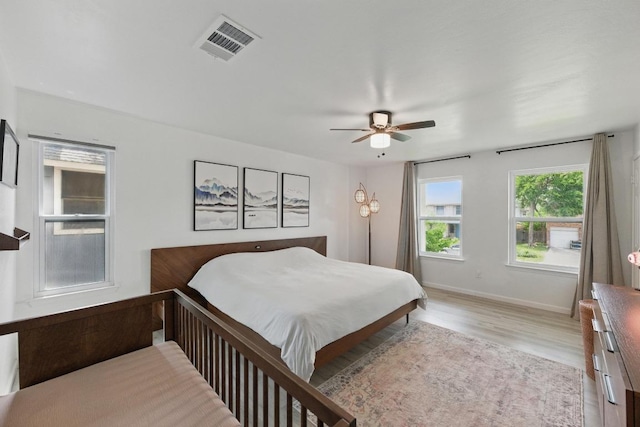 8805 Ravello Pass, Austin, TX 78749 - bedroom featuring light wood-type flooring, baseboards, and a ceiling fan