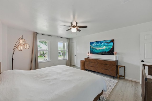 8805 Ravello Pass, Austin, TX 78749 - bedroom featuring light wood-style flooring, baseboards, and ceiling fan