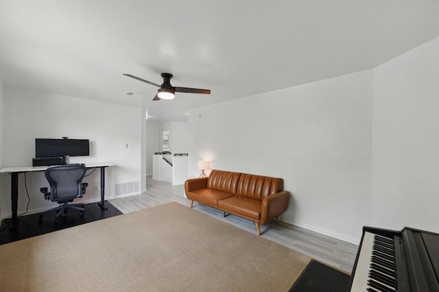 8805 Ravello Pass, Austin, TX 78749 - home office featuring light wood finished floors, baseboards, and a ceiling fan