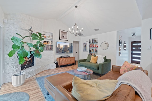 living room featuring wood finished floors and a chandelier