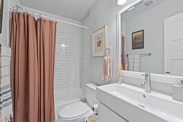bathroom with toilet, shower / bath combination with curtain, and vanity