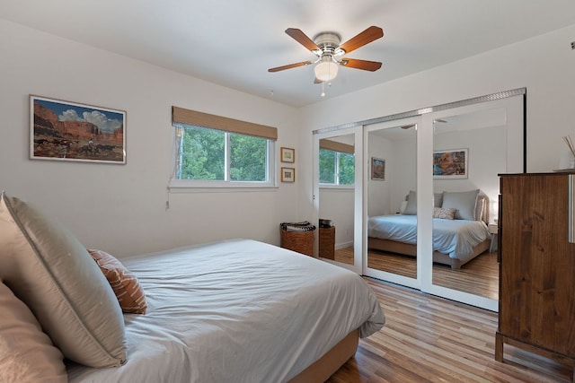 2612 Baxter Dr, Austin, TX 78745 - bedroom with wood finished floors, a ceiling fan, and a closet