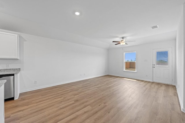 464 Aplite Pass, Maxwell, TX 78656 - unfurnished living room with ceiling fan, light wood finished floors, and baseboards