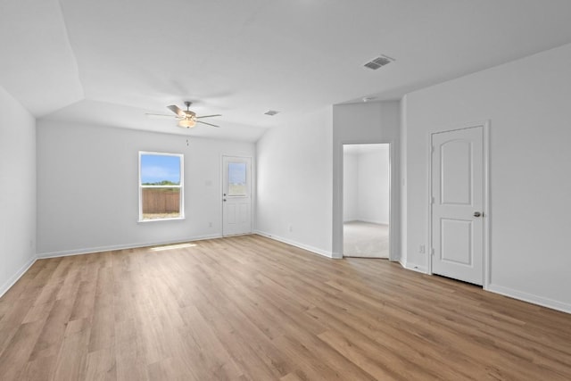 464 Aplite Pass, Maxwell, TX 78656 - unfurnished living room with light wood-style floors, a ceiling fan, and baseboards