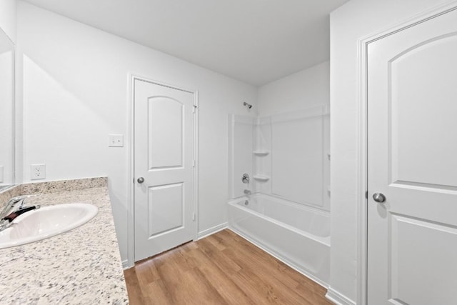 464 Aplite Pass, Maxwell, TX 78656 - bathroom with wood finished floors, shower / bath combination, and vanity