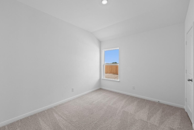 464 Aplite Pass, Maxwell, TX 78656 - spare room with baseboards, light carpet, and lofted ceiling