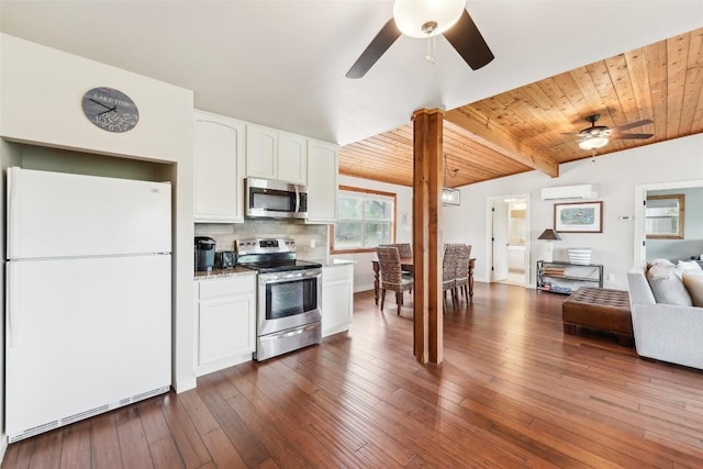 913 Lake Shore Dr, Spicewood, TX 78669 - kitchen featuring stainless steel appliances, a wall mounted air conditioner, ceiling fan, open floor plan, and white cabinets