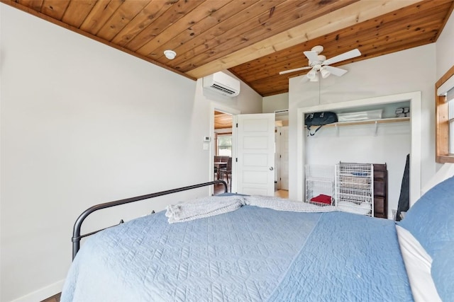 913 Lake Shore Dr, Spicewood, TX 78669 - bedroom with an AC wall unit, wooden ceiling, a closet, lofted ceiling, and a ceiling fan