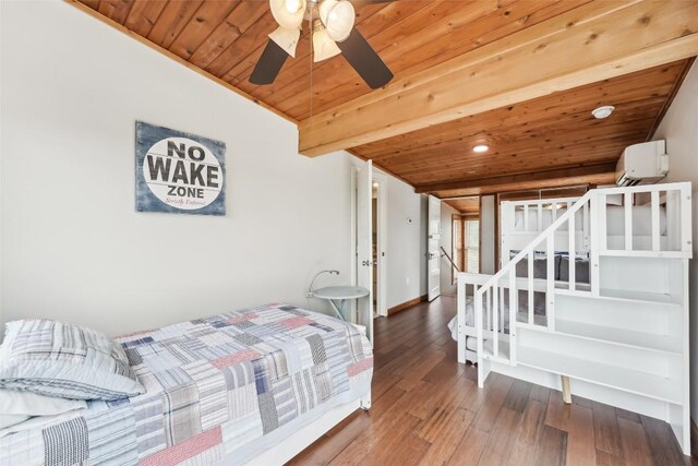 913 Lake Shore Dr, Spicewood, TX 78669 - bedroom featuring wooden ceiling with exposed beams, a wall unit AC, wood finished floors, baseboards, and recessed lighting