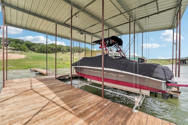 913 Lake Shore Dr, Spicewood, TX 78669 - dock with boat lift and a water view
