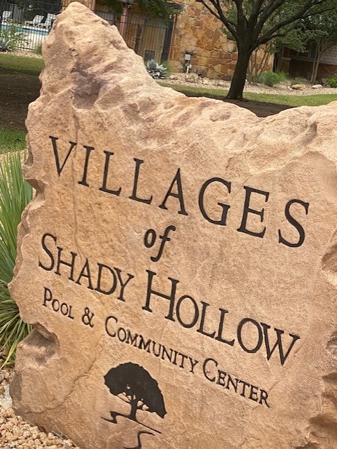 community sign with fence