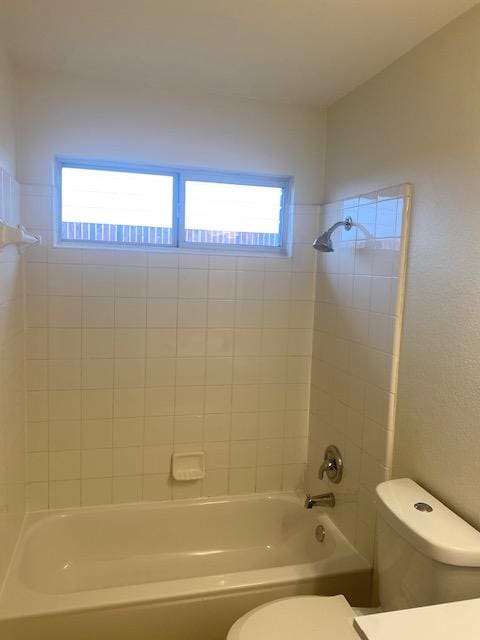 full bathroom with toilet and tub / shower combination