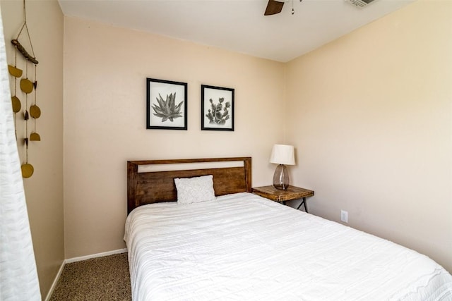 carpeted bedroom with baseboards and a ceiling fan