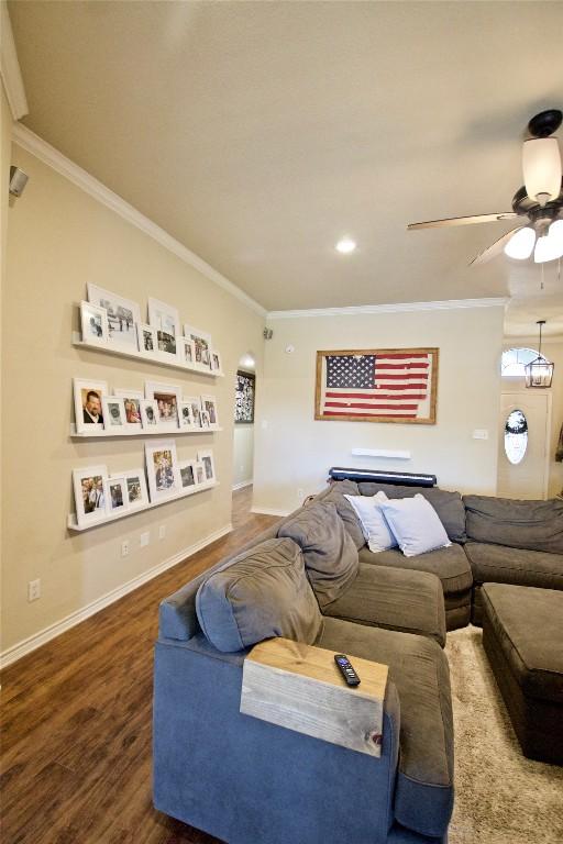 2502 Joseph Dr, Copperas Cove, TX 76522 - living room with wood finished floors, ornamental molding, a ceiling fan, and baseboards