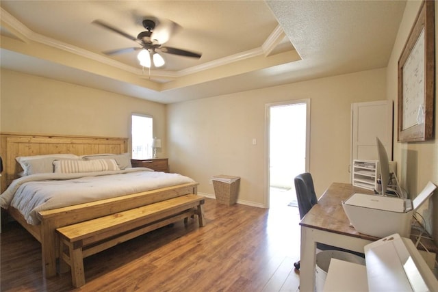 2502 Joseph Dr, Copperas Cove, TX 76522 - bedroom featuring a tray ceiling, ornamental molding, wood finished floors, a desk, and ceiling fan