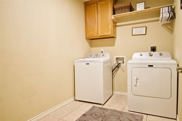 2502 Joseph Dr, Copperas Cove, TX 76522 - laundry area with cabinet space, separate washer and dryer, light tile patterned floors, and baseboards