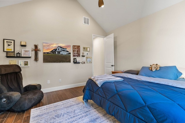 479 Brown Rd, Mcdade, TX 78650 - bedroom with wood finished floors, baseboards, and high vaulted ceiling