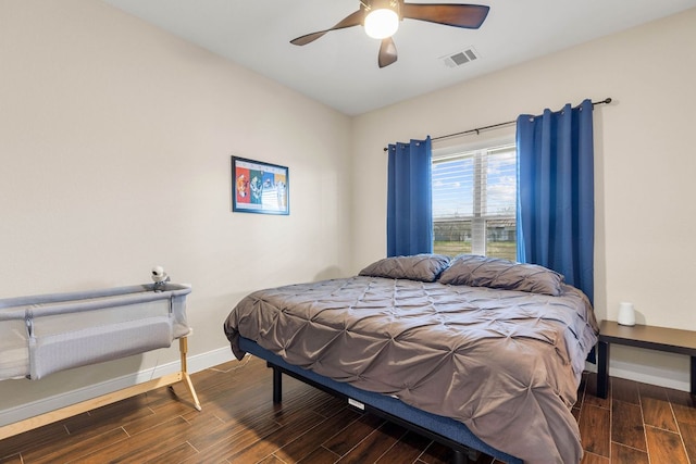479 Brown Rd, Mcdade, TX 78650 - bedroom with wood finished floors, baseboards, and a ceiling fan