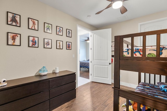 479 Brown Rd, Mcdade, TX 78650 - bedroom featuring wood finished floors and ceiling fan