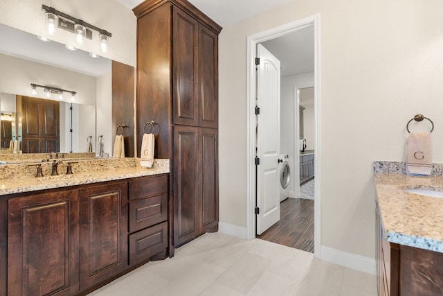 479 Brown Rd, Mcdade, TX 78650 - bathroom with vanity, baseboards, and washer / dryer