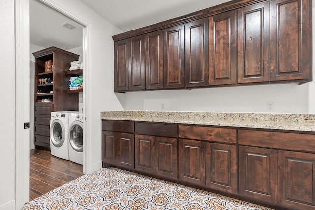 479 Brown Rd, Mcdade, TX 78650 - laundry area with washer and dryer, baseboards, and wood finished floors