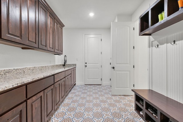 479 Brown Rd, Mcdade, TX 78650 - laundry room featuring light tile patterned floors, a sink, recessed lighting, and baseboards