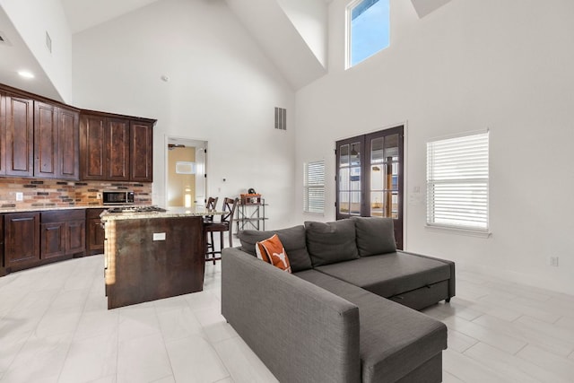 479 Brown Rd, Mcdade, TX 78650 - living room featuring french doors and high vaulted ceiling