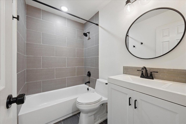 909 Reinli St Unit 231, Austin, TX 78751 - full bath featuring toilet, decorative backsplash, shower / bath combination, and vanity