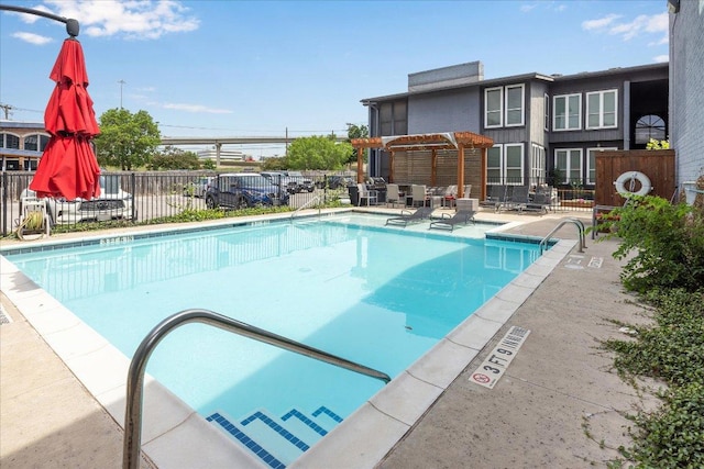 909 Reinli St Unit 231, Austin, TX 78751 - community pool with a pergola, fence, and a patio