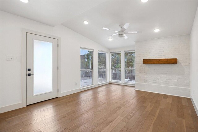 909 Reinli St Unit 231, Austin, TX 78751 - unfurnished living room featuring hardwood / wood-style floors, ceiling fan, lofted ceiling, and recessed lighting