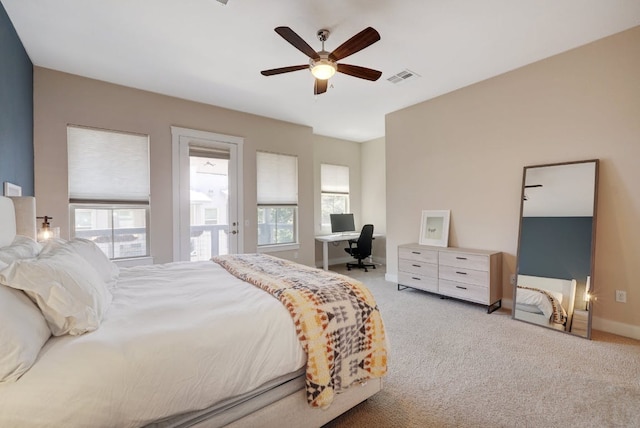 2520 Bluebonnet Ln Unit 41, Austin, TX 78704 - bedroom with multiple windows, carpet, and a desk