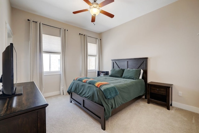 2520 Bluebonnet Ln Unit 41, Austin, TX 78704 - bedroom with light colored carpet, baseboards, and ceiling fan