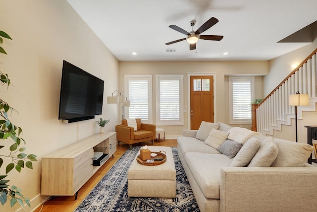 2520 Bluebonnet Ln Unit 41, Austin, TX 78704 - living room featuring light wood-style floors, a ceiling fan, stairs, baseboards, and recessed lighting