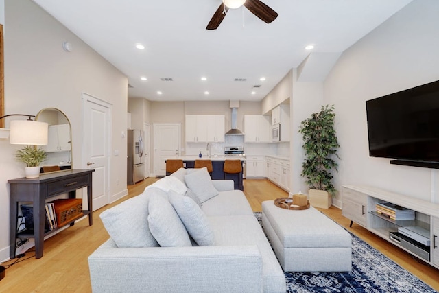 2520 Bluebonnet Ln Unit 41, Austin, TX 78704 - living area with ceiling fan, light wood finished floors, recessed lighting, and baseboards