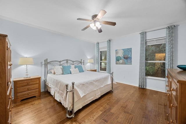 2518 Nightshade Dr, Cedar Park, TX 78613 - bedroom with wood finished floors, crown molding, baseboards, and ceiling fan