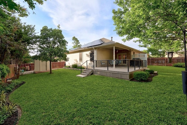 2518 Nightshade Dr, Cedar Park, TX 78613 - back of property featuring a fenced backyard, solar panels, a wooden deck, and ceiling fan