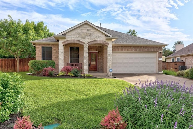 2518 Nightshade Dr, Cedar Park, TX 78613 - view of front of property featuring concrete driveway, a garage, covered porch, and roof with shingles