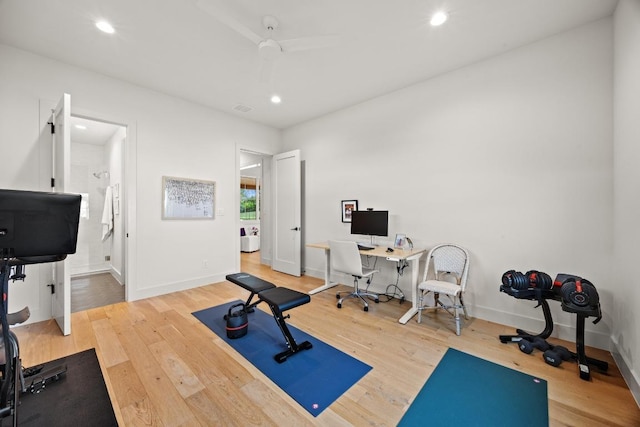 workout area with recessed lighting, wood finished floors, and baseboards