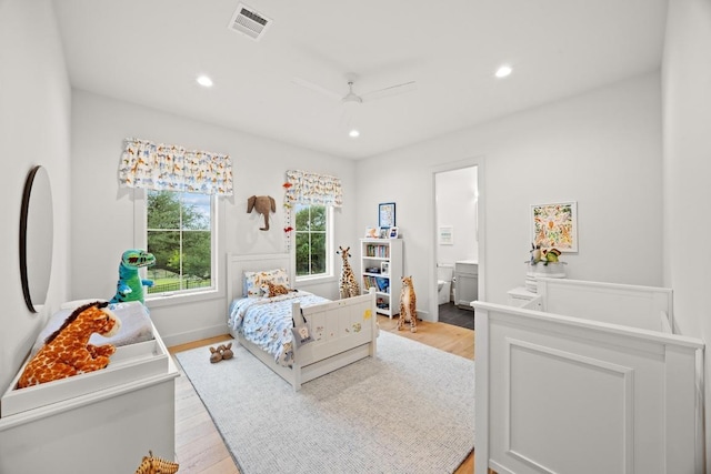 bedroom with recessed lighting, light wood finished floors, baseboards, ensuite bathroom, and a ceiling fan