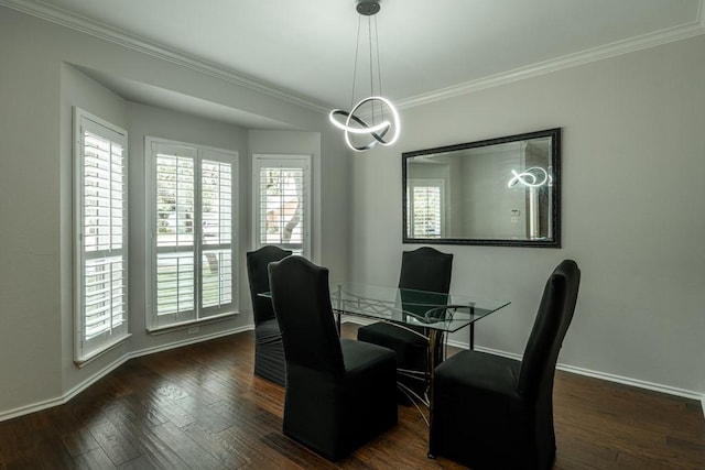 8610 Axis Dr, Austin, TX 78749 - dining space featuring healthy amount of natural light, ornamental molding, baseboards, dark wood finished floors, and a chandelier