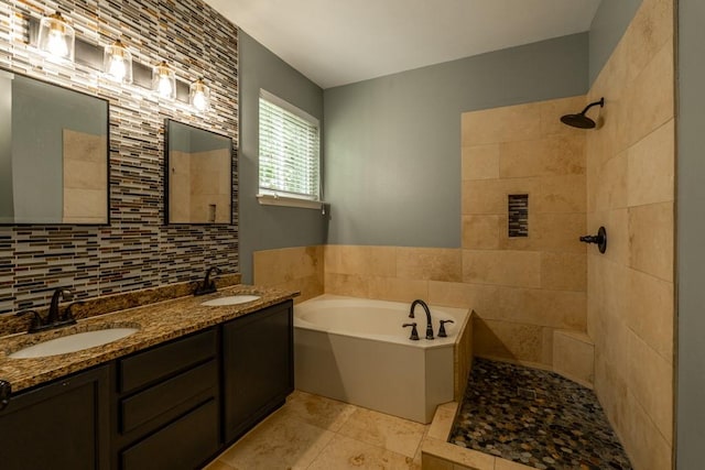 8610 Axis Dr, Austin, TX 78749 - bathroom with a garden tub, tiled shower, double vanity, tile walls, and tasteful backsplash
