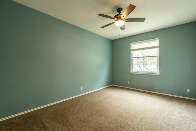 8610 Axis Dr, Austin, TX 78749 - spare room with carpet floors, a ceiling fan, and baseboards