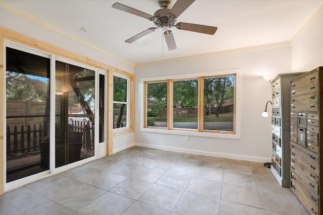 3508 Winfield Cv, Austin, TX 78704 - spare room featuring light tile patterned flooring, baseboards, ornamental molding, and a ceiling fan