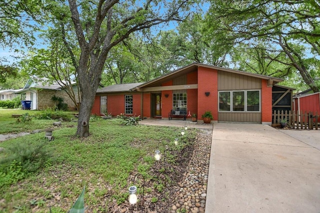 3508 Winfield Cv, Austin, TX 78704 - mid-century home with concrete driveway and brick siding